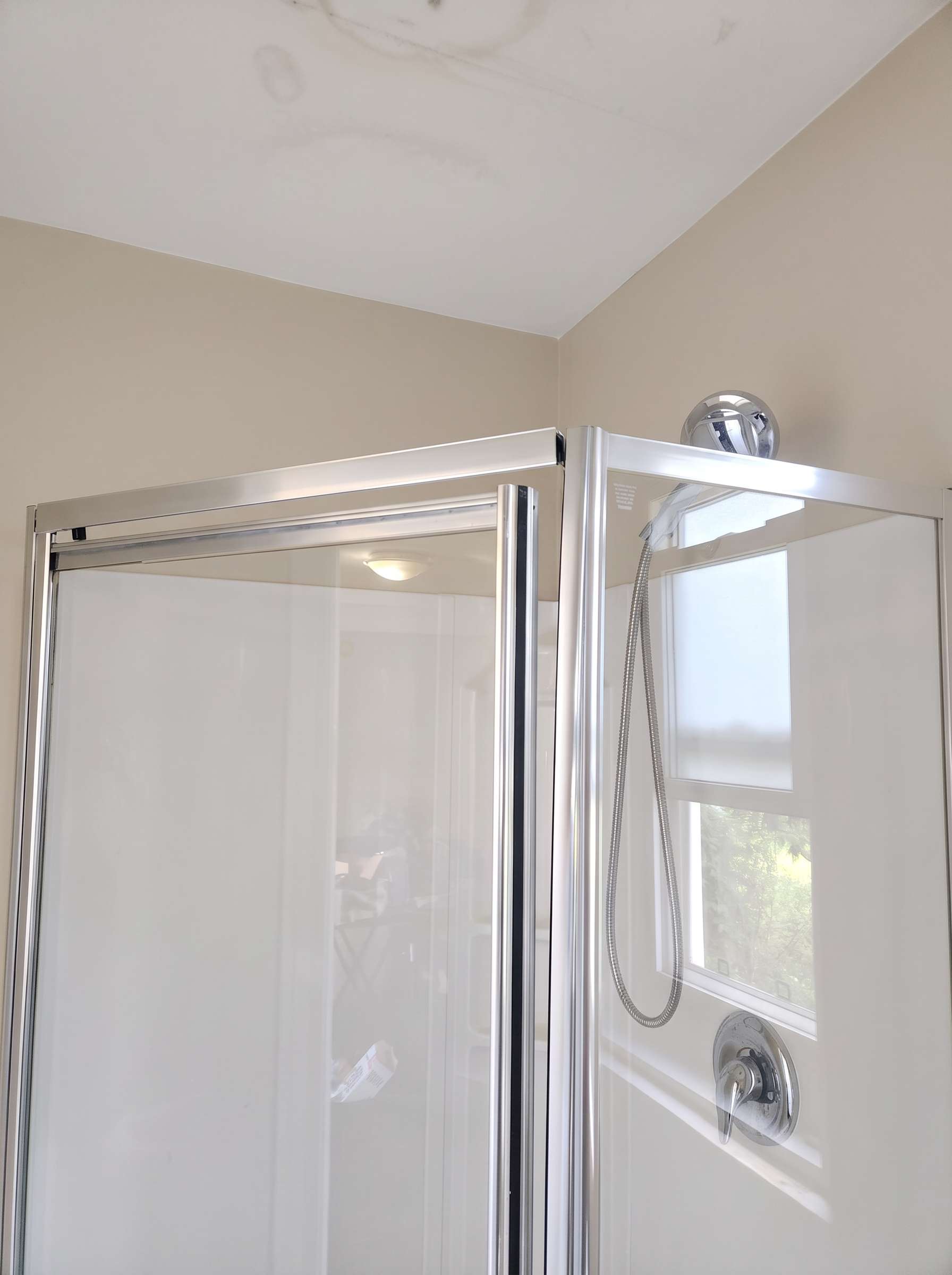 Same shower stall and ceiling spotless after deep cleaning