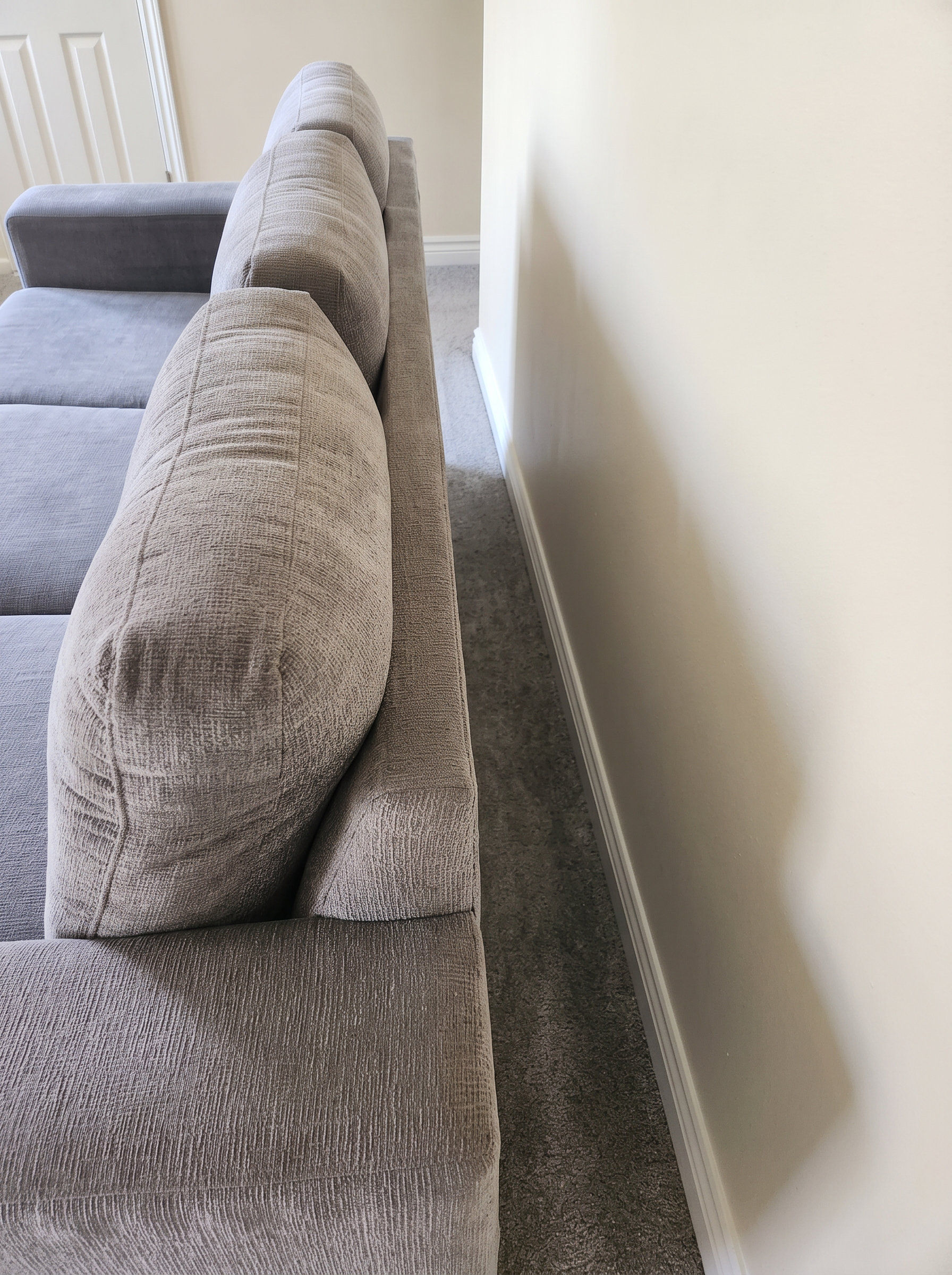 Same sofa and walls fresh and clean after restoration cleaning
