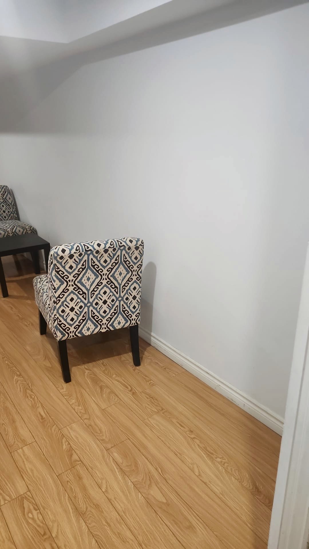 Clean, bright living area with polished hardwood floors