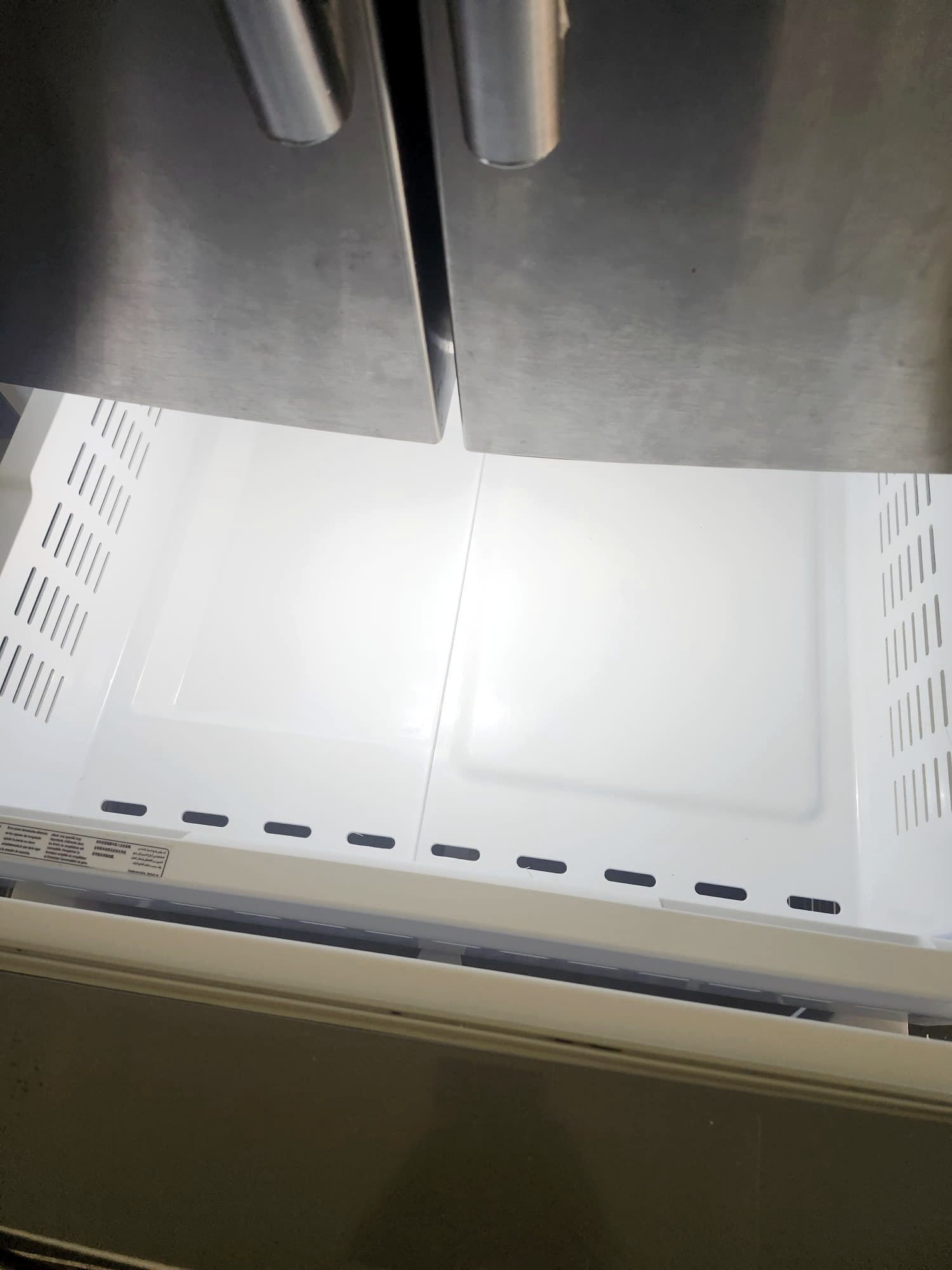 Wiped-down fridge drawers and stainless steel doors
